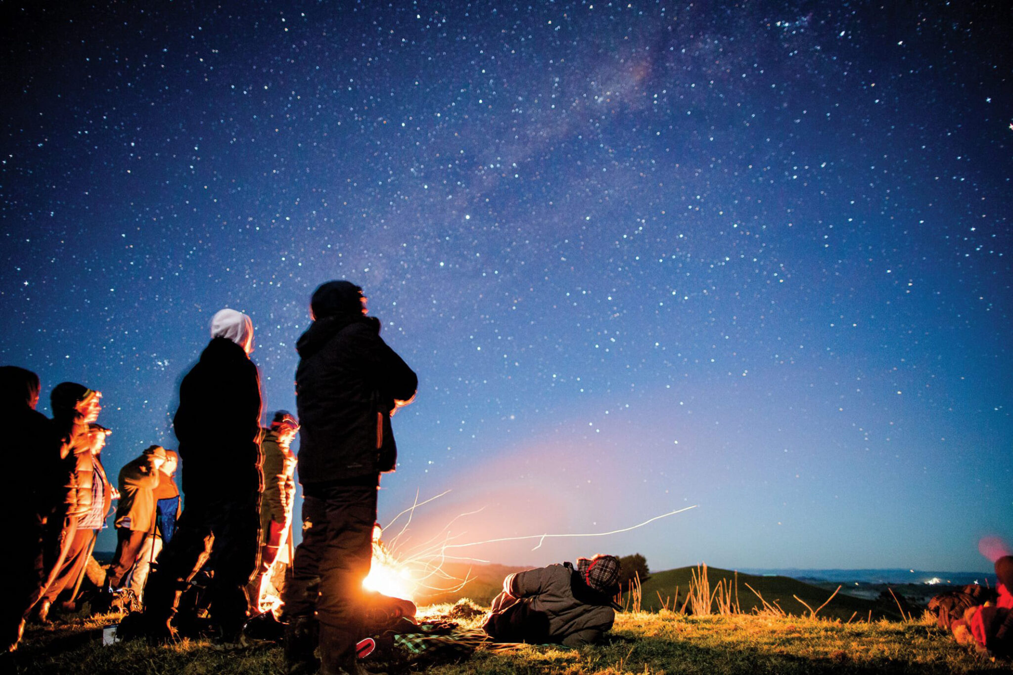 People looking up to the Matariki stars